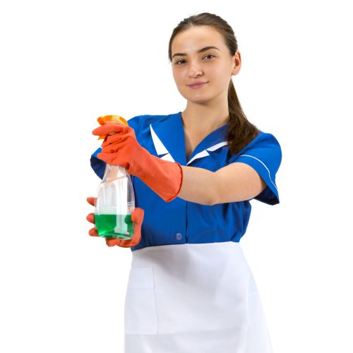 Cleaner using. Portrait of female made, housemaid, cleaning worker in white and blue uniform isolated over white background. Copyspace for ad. Concept of professional occupation, job, emotions.